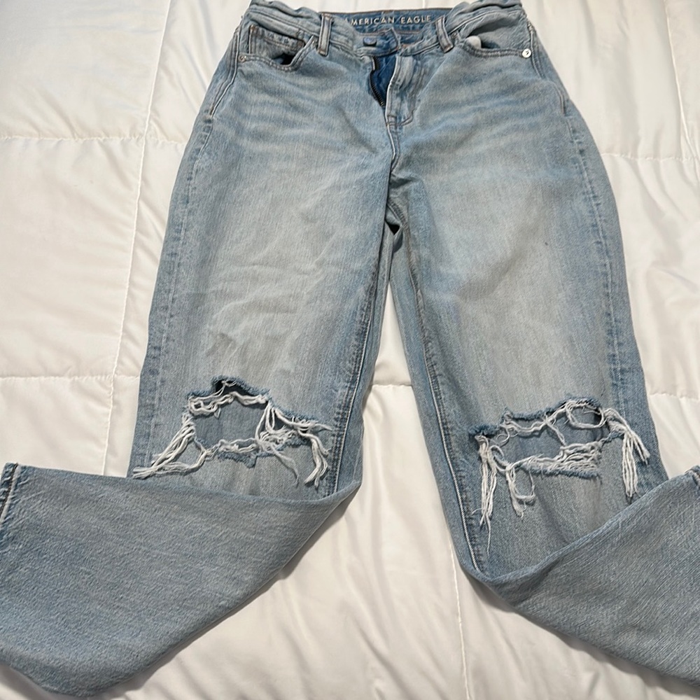 Distressed, jeans ripped at the knees